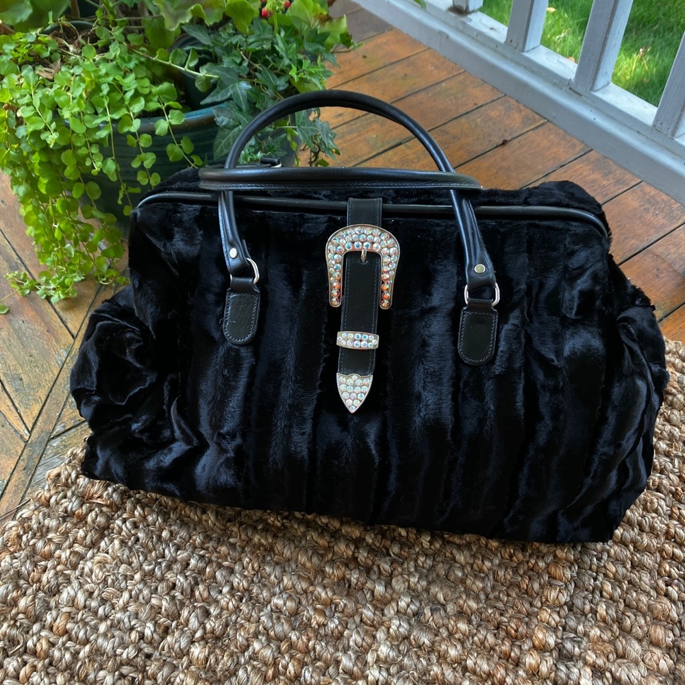 Solid black pony fur overnight bag with Swarovski Crystal buckle. Like new